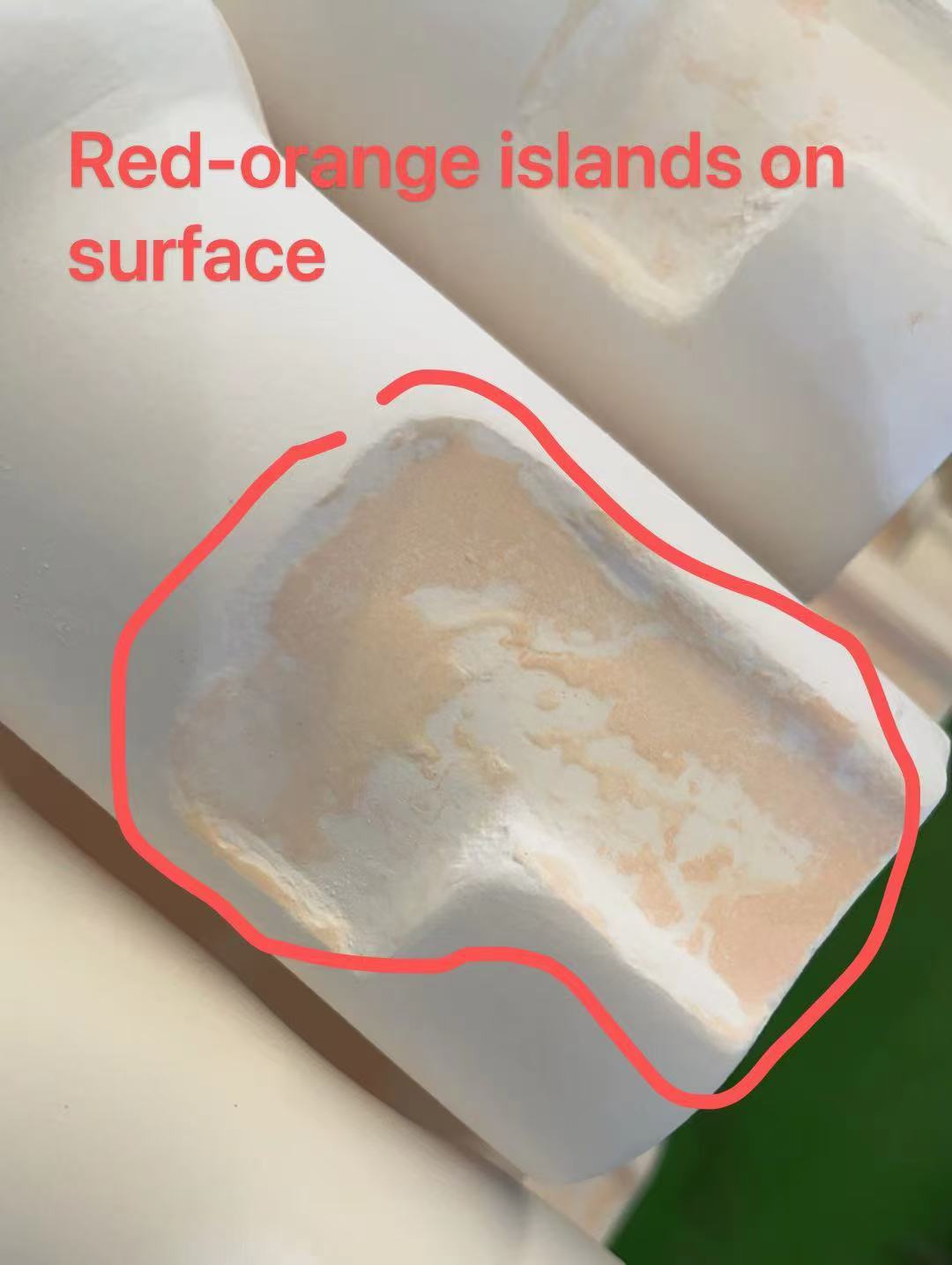 Localised red-orange discoloration patches on the customer's finished product.