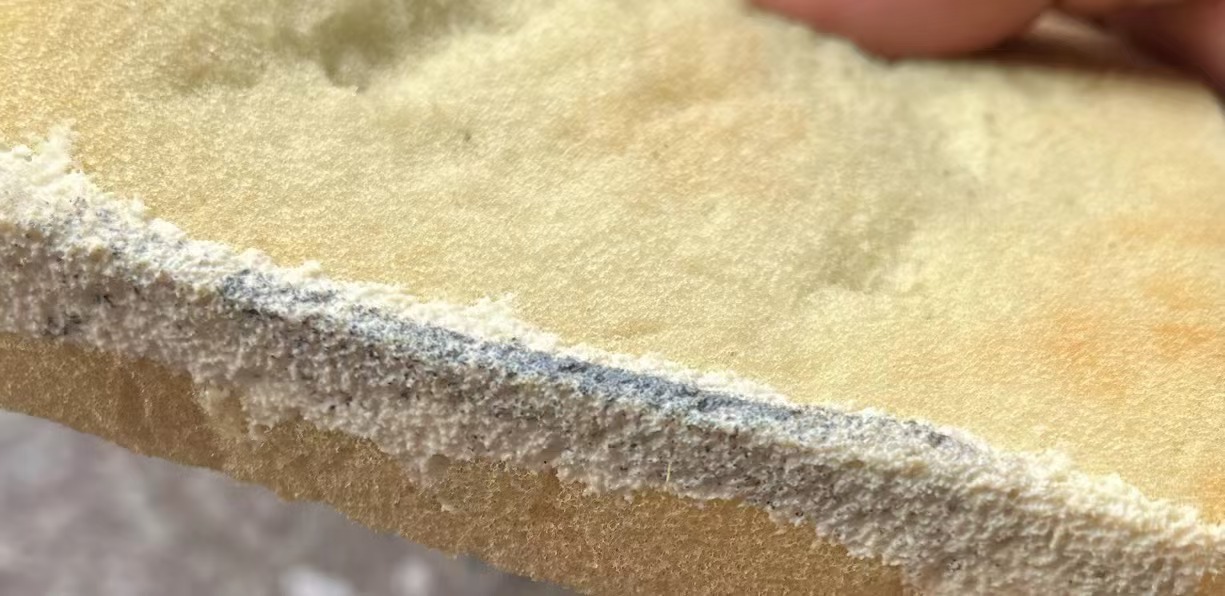 Yellow-brown discoloration appearing on a fused silica sample after wetting and standing.