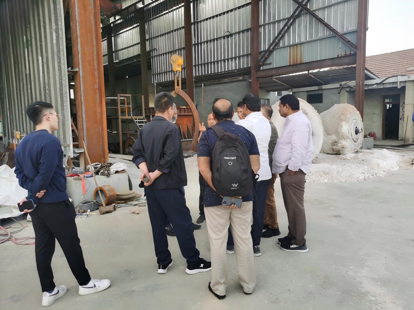 Customers visiting the fused silica production site with Chemsize team — viewing freshly fused silica ingot in the workshop