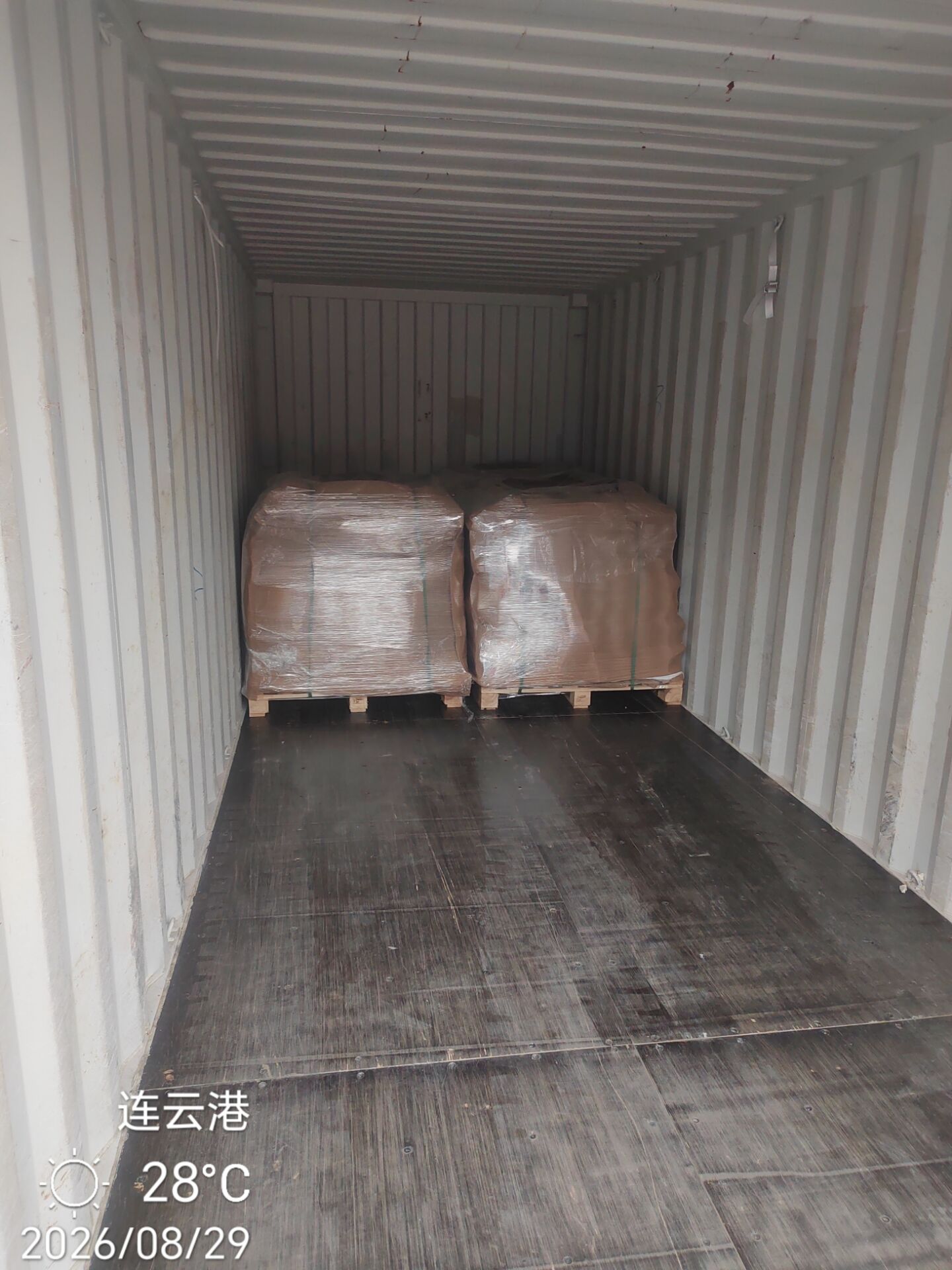 Palletised fused silica products placed inside an empty export container, ready for loading.