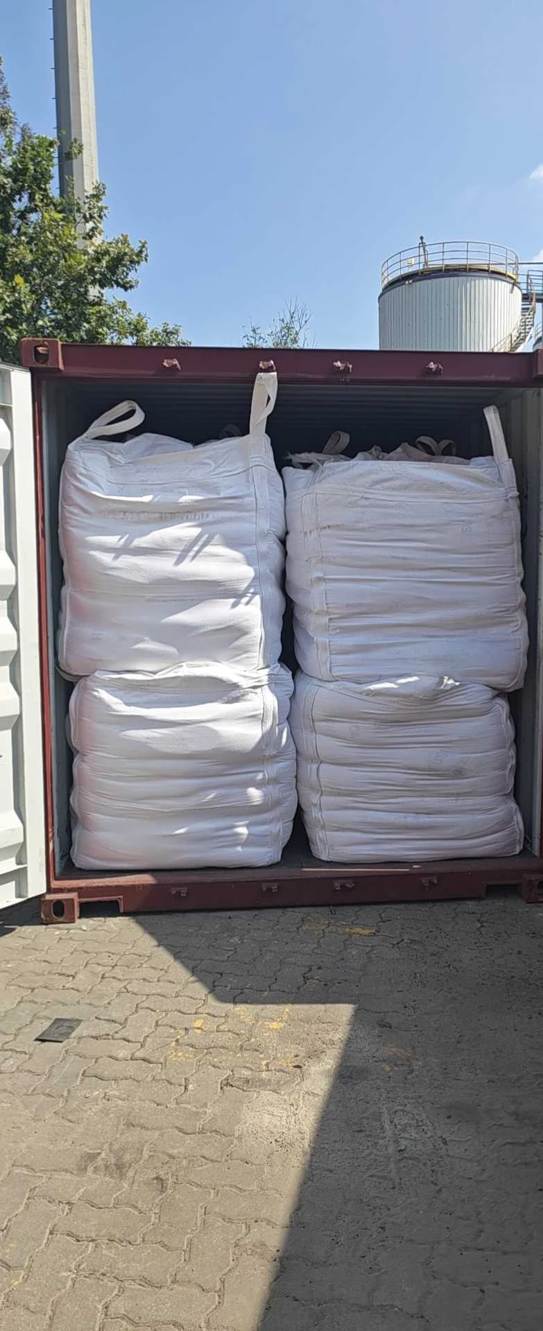 FIBC jumbo bags of fused silica stacked inside an open export container after loading, 8 September 2026.